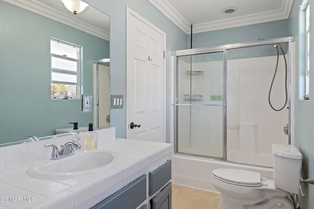 full bathroom featuring crown molding, vanity, toilet, and enclosed tub / shower combo