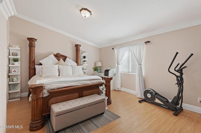 bedroom featuring ornamental molding and light wood-type flooring