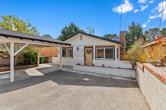 view of front of house featuring a carport