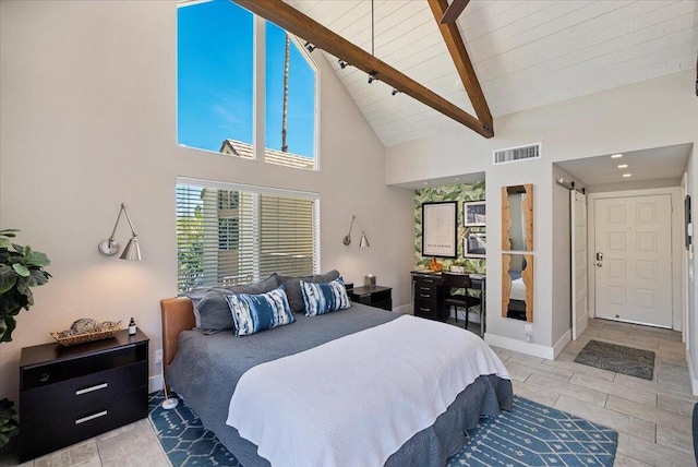 bedroom featuring high vaulted ceiling and beamed ceiling