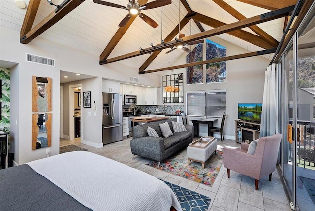 bedroom with stainless steel fridge with ice dispenser, beamed ceiling, and high vaulted ceiling