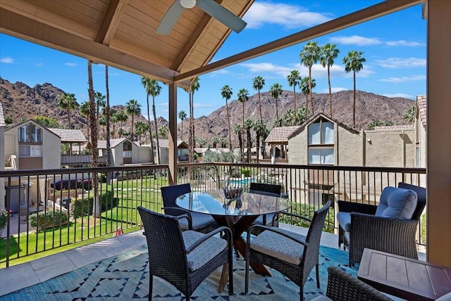 view of patio featuring a mountain view and ceiling fan