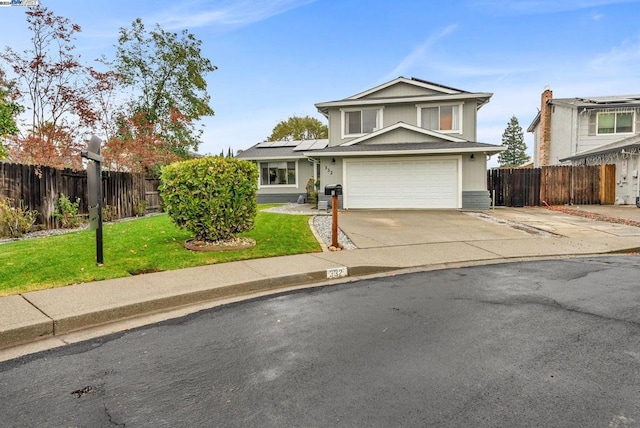 front of property with a front lawn, solar panels, and a garage