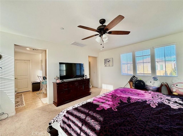 bedroom with light colored carpet and ceiling fan