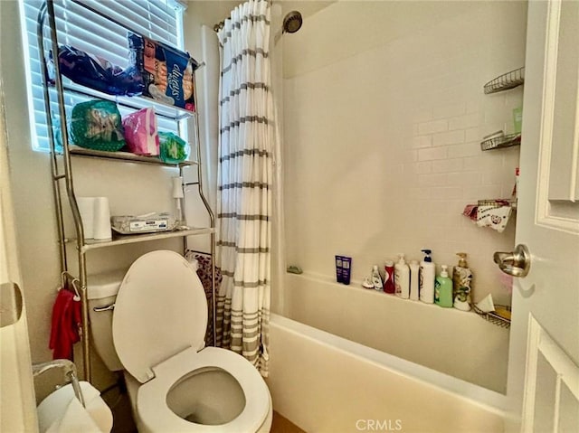 bathroom featuring toilet and shower / tub combo with curtain