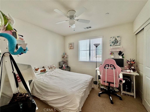 carpeted bedroom with ceiling fan