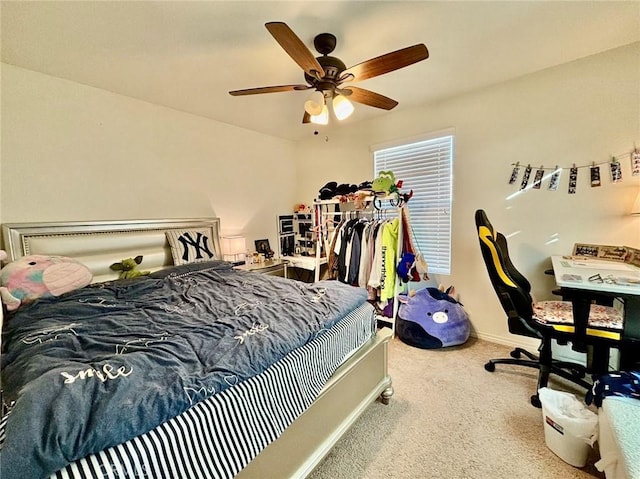 bedroom with ceiling fan and carpet