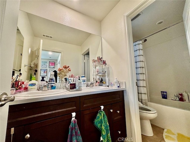 full bathroom featuring vanity, shower / bathtub combination with curtain, and toilet