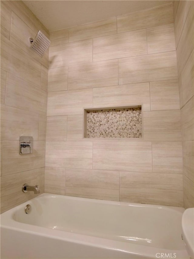 bathroom with shower / bathing tub combination