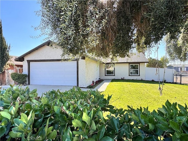 single story home featuring a front lawn and a garage