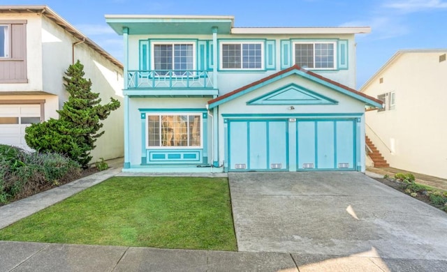 view of front of property featuring a balcony and a front lawn