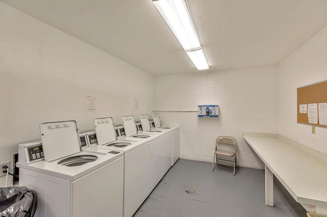 clothes washing area with independent washer and dryer