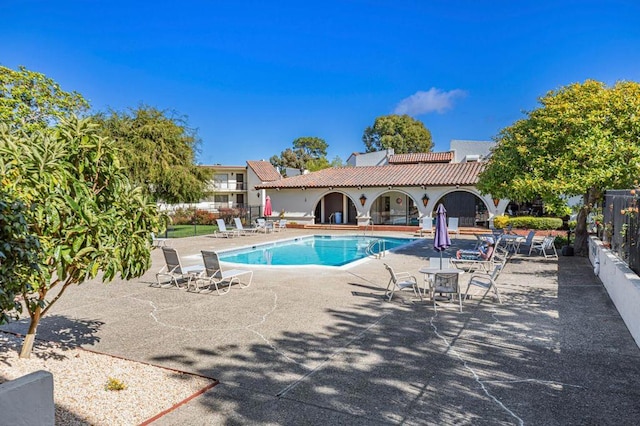 view of swimming pool featuring a patio