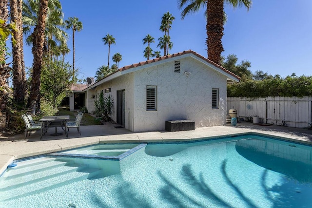 view of swimming pool with a patio area