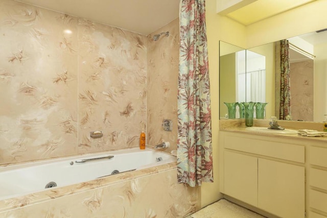 bathroom featuring vanity and tiled shower / bath