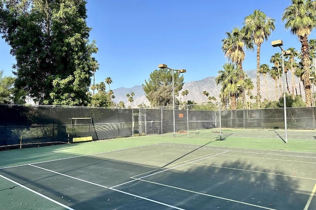 view of sport court with a mountain view