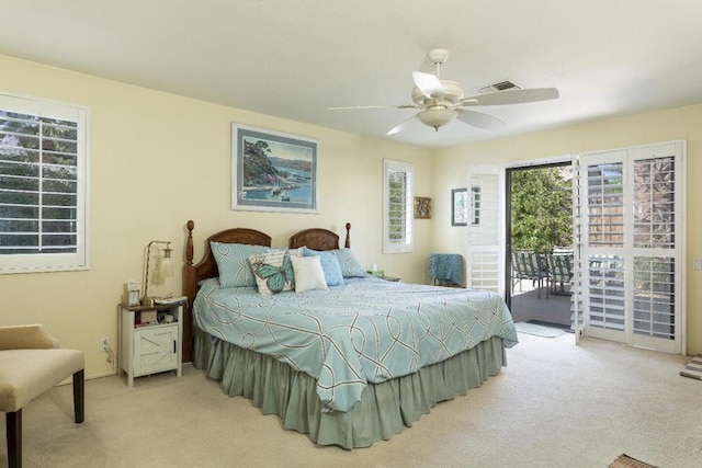 carpeted bedroom featuring access to outside and ceiling fan