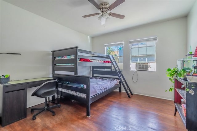 bedroom with dark wood-type flooring, ceiling fan, and cooling unit