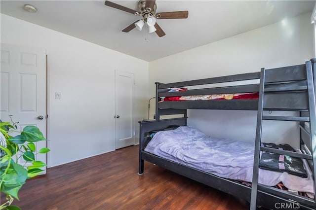 bedroom featuring dark wood-type flooring and ceiling fan