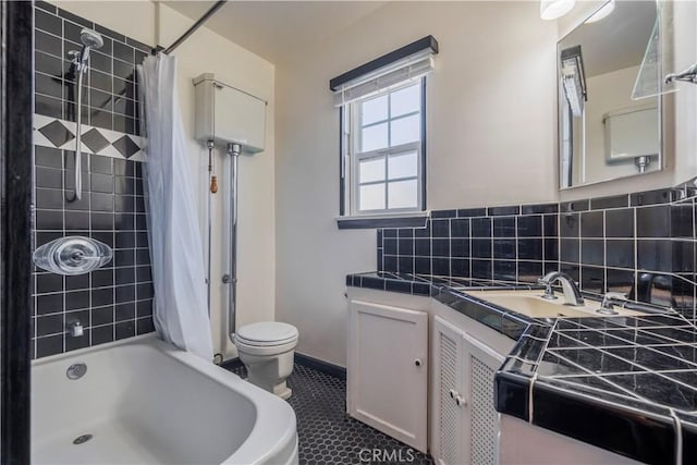 full bathroom featuring toilet, shower / bath combo, backsplash, tile patterned floors, and vanity