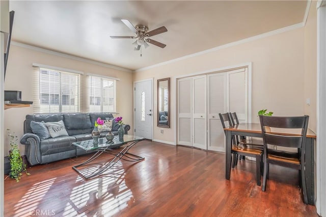 living room featuring ceiling fan, crown molding, and dark hardwood / wood-style floors