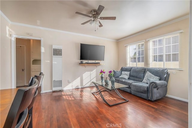 living room with ceiling fan, ornamental molding, and dark hardwood / wood-style flooring