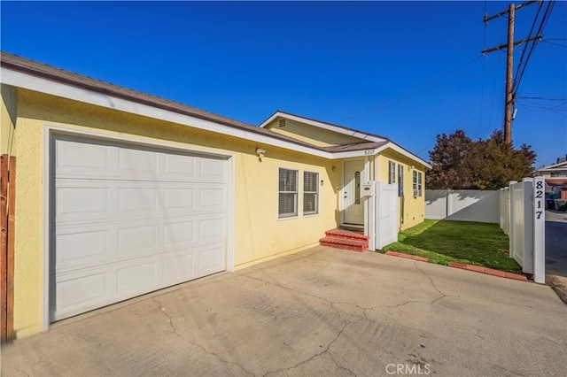 ranch-style house featuring a garage