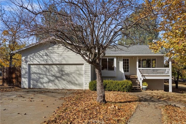 ranch-style home with concrete driveway, stairway, and an attached garage