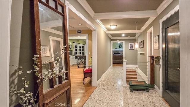 corridor featuring light hardwood / wood-style flooring and ornamental molding