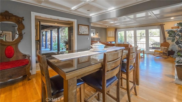 dining space featuring beamed ceiling, light wood-type flooring, french doors, and coffered ceiling