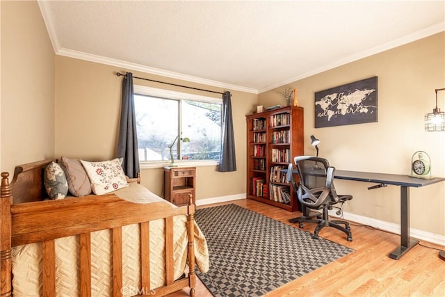 bedroom featuring ornamental molding and light wood-type flooring