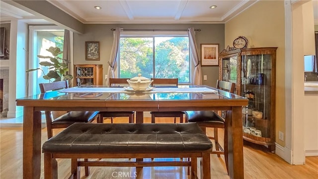 dining room featuring light hardwood / wood-style floors and ornamental molding