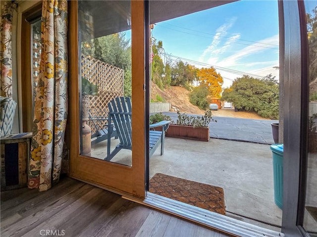 doorway to outside featuring hardwood / wood-style flooring