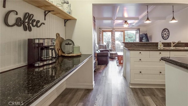 kitchen featuring coffered ceiling, sink, beam ceiling, dark hardwood / wood-style flooring, and white cabinetry