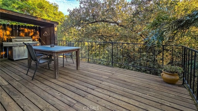 wooden terrace with grilling area