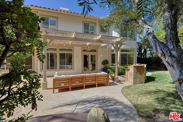 back of house featuring french doors, an outdoor living space, a patio, and a pergola