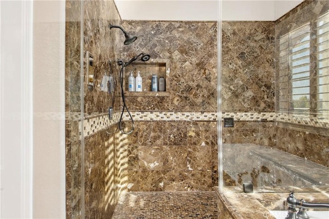 bathroom with a tile shower