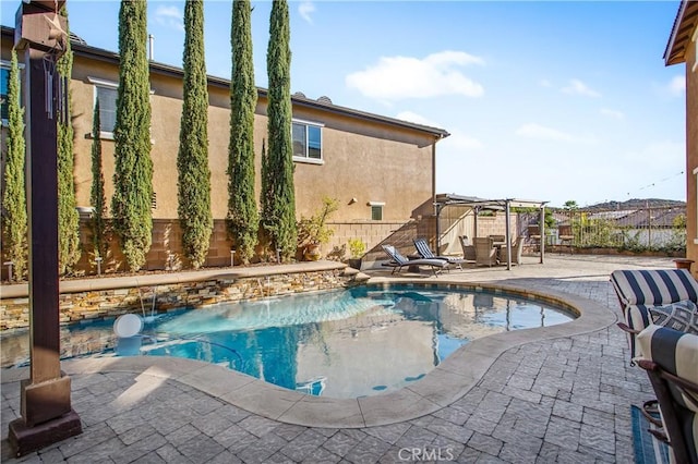 view of swimming pool featuring a patio area