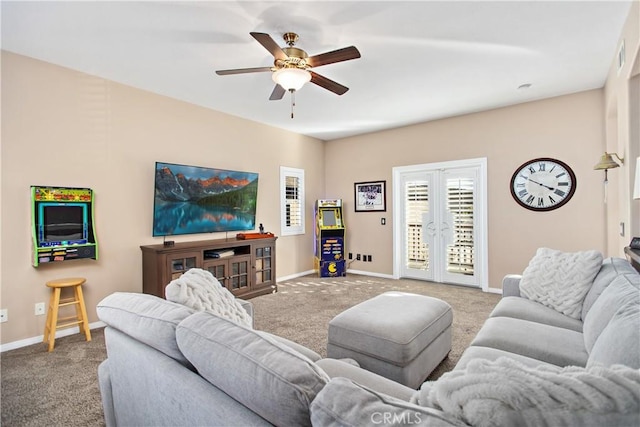 living room featuring ceiling fan, french doors, and light colored carpet