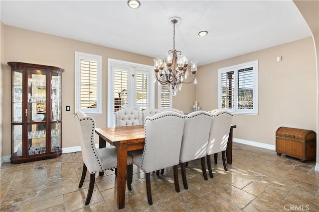 dining space featuring a chandelier