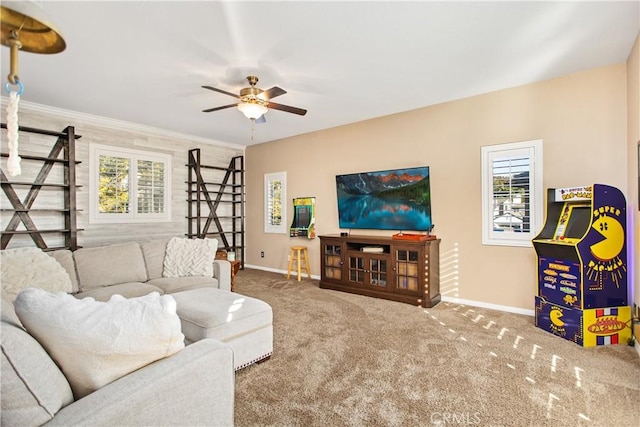 living room featuring carpet, plenty of natural light, crown molding, and ceiling fan