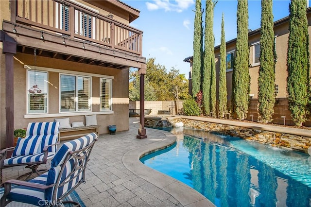 view of pool featuring a patio and pool water feature