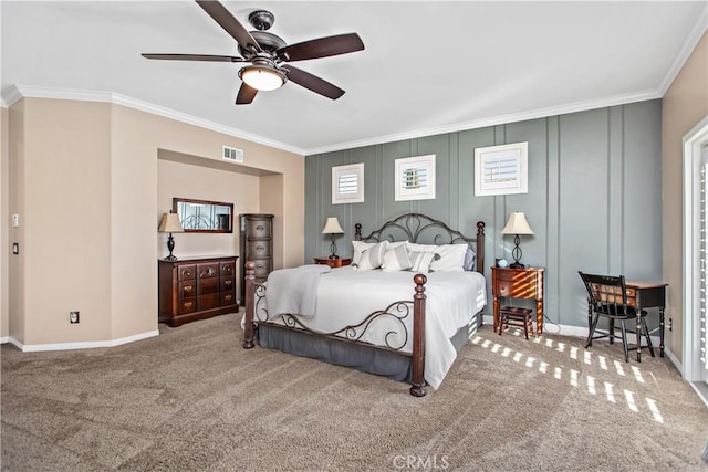 bedroom featuring ceiling fan, carpet floors, and ornamental molding