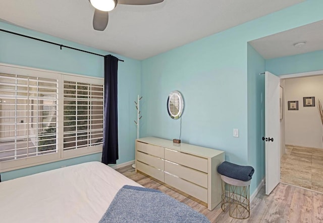 bedroom featuring ceiling fan and light hardwood / wood-style floors