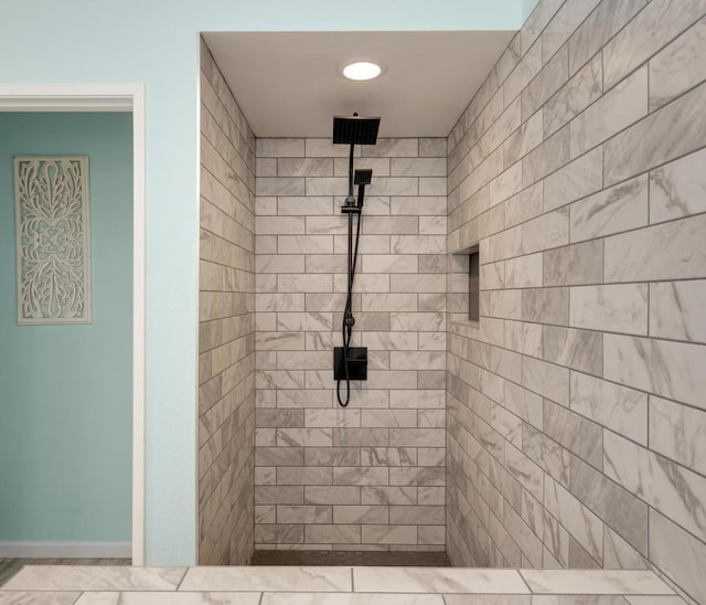 bathroom featuring tiled shower