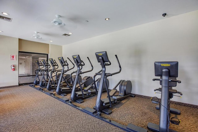 exercise room featuring ceiling fan and carpet floors