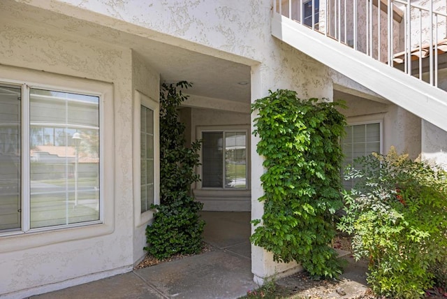 entrance to property featuring a balcony