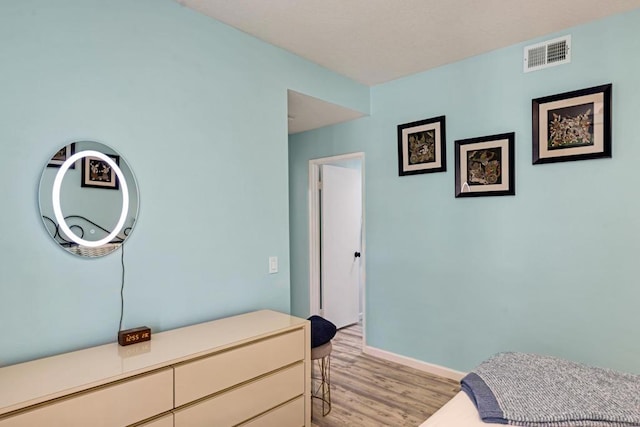 bedroom featuring light hardwood / wood-style floors