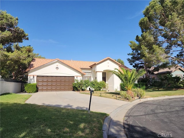 view of front of house with a front lawn and a garage