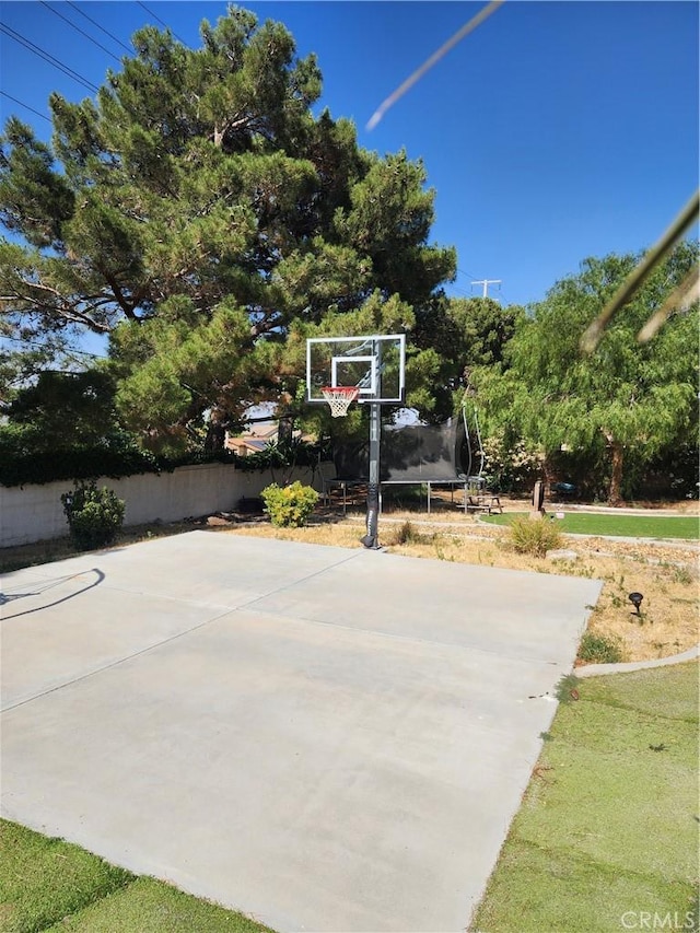 view of sport court with a trampoline